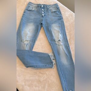 Women’s faded button fly stretch jeans